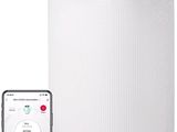 le purificateur d'air se trouve à côté d'un smartphone