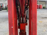 a close up of a red machine with wires attached to it