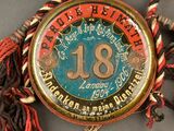 an old pocket watch with a tassel around it