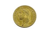 a close up of a gold coin on a white background