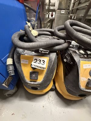 two vacuums that are sitting next to each other on the floor