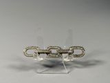 a close up of a pair of earrings on a clear stand