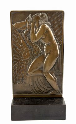 bronze sculpture of a woman kneeling with her hands on her head