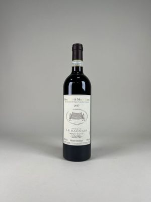 the bottle of red wine is sitting on the table