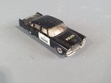 a small toy car that is sitting on a table