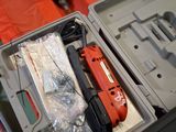 a box with tools in it sitting on the floor
