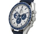 a close up of a watch on a white background with a blue strap