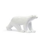 a white polar bear figurine standing on a white surface