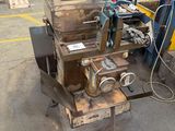 a machine that is sitting on a table in a warehouse