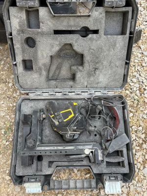a tool in a case that is sitting on the ground
