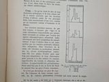 an open book with a drawing of a building in it