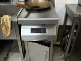 a small kitchen with a stove and a sink