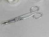 a pair of scissors and a pair of scissors on a table