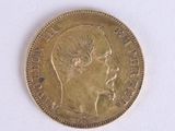 a gold coin with a picture of a woman on it