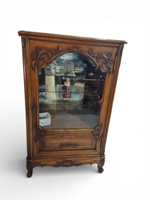 an image of a wooden cabinet with a mirror on top of it