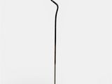 a black and gold floor lamp with a metal base