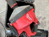 an overhead view of a tool box with a drill and other tools