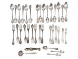 an assortment of silverware including spoons, forks and spoons