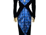 a mannequin wearing a blue and black dress on a stand