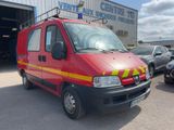 a red van that is parked in front of a building