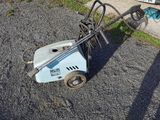 a small machine that is sitting on the ground