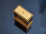 a small wooden box sitting on top of a table