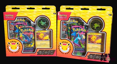 two packs of pokemon trading cards are in the packaging