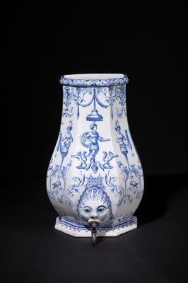 blue and white vase on stand on a black background