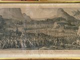 an old picture of a large group of people standing in front of a mountain