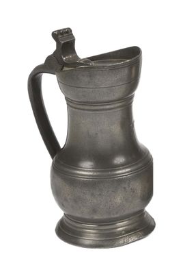 a small metal pitcher with a handle on a white background