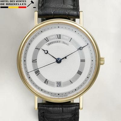 an image of a close up of a wrist watch with roman numerals