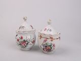 pair of antique porcelain sugar and creamers with floral designs