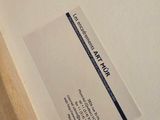 a close up of a picture of a book with a label on it