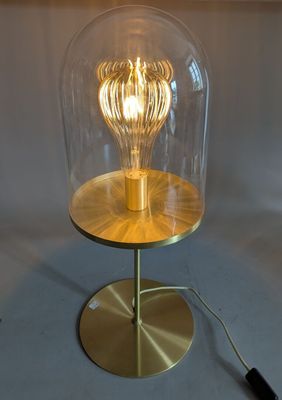 an image of a table lamp with a glass dome on it
