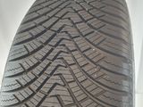 a close up of a tire on a white surface