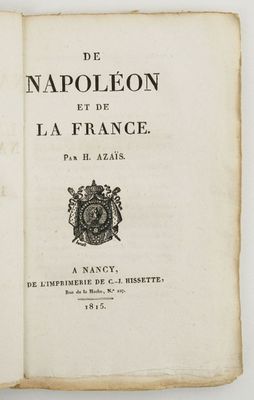 an open book with a black and white image of a coat of arms