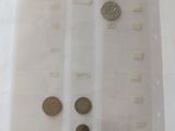 some coins are sitting in a clear plastic bag on a table