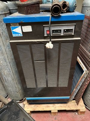 a small air conditioner sitting on top of a pallet
