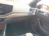 a dashboard of a car with a steering control