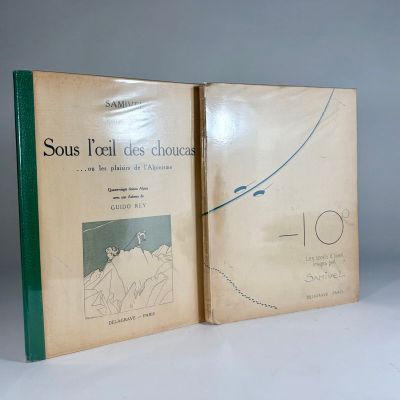 deux livres posés sur une table blanche, dont l'un a une couverture verte et représente une femme