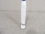 a white and blue tennis racket sitting on the floor
