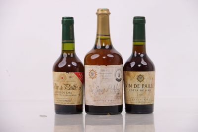 three bottles of wine sitting on top of a table next to each other