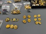 a table with a lot of gold coins and other items on it