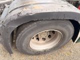 a close up of a flat tire on a semi truck