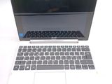 a laptop computer that is sitting on a white table
