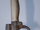 a close up of a knife with a handle on it