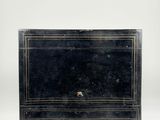 an old black chest of drawers with two drawers on each side and a drawer on the other side