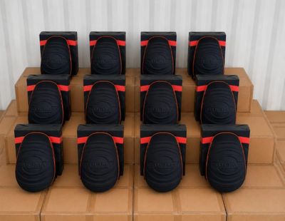 a stack of boxes that have a bunch of speakers on them