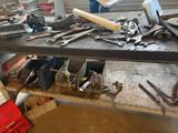 many tools on a workbench in a workshop