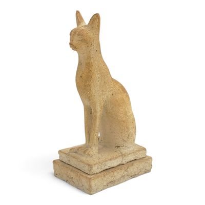 an image of a statue of a cat sitting on top of a stone block